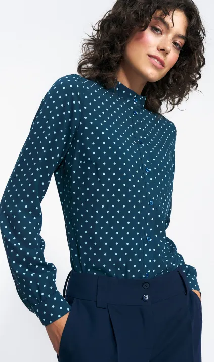 Green blouse in polka dots